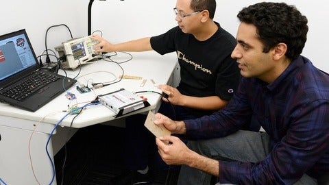 two men working on a computer