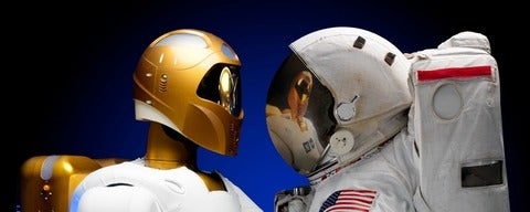 Astronaut staring at robot