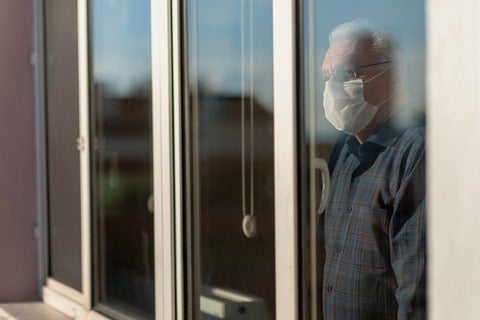 Senior looking out the window