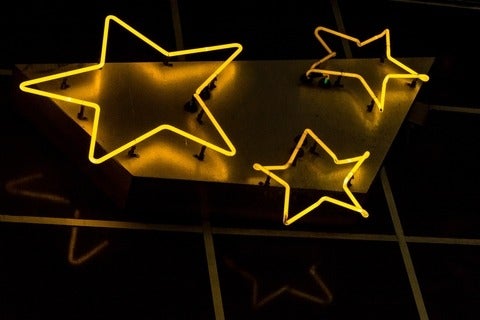 Neone sign that shows three gold stars