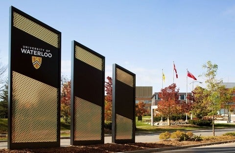 Signs outside the entrance to UW campus