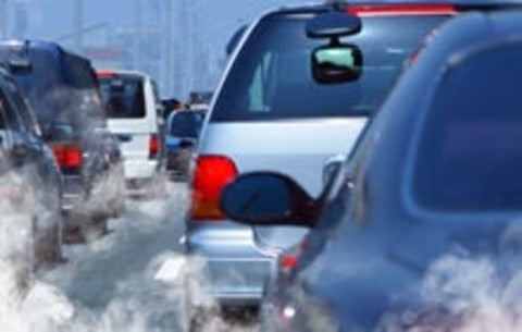 Traffic jam with exhaust billowing around cars