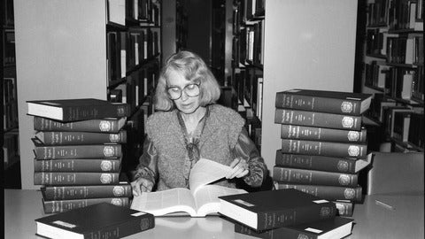Woman reading Oxford English Dictionary