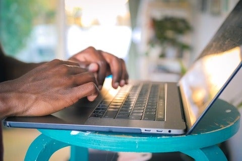 Hands typing on keyboard 