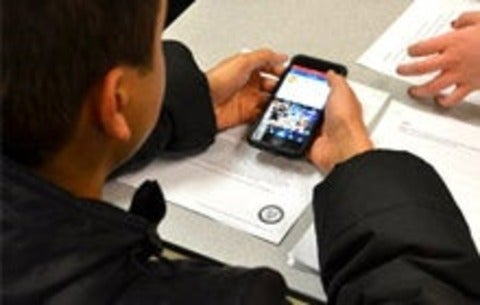 Student participating in user testing on a smartphone