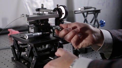 Close-up of the hand of a Vena Medical technician testing equipment 