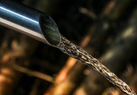 Image of water pipe with water coming out of it