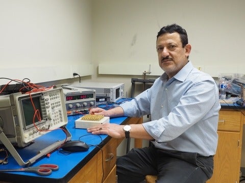 Professor Omar Ramahi sitting in his lab at the University of Waterloo. 