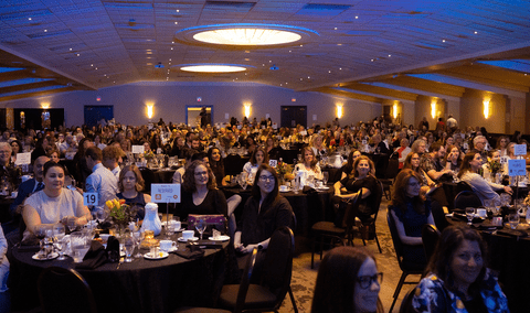 Attendees sitting at tables for the Women of the Year awards