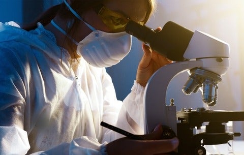 Girl looking in microscope 