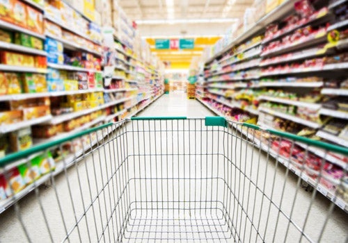 Shopping cart in grocery aisle