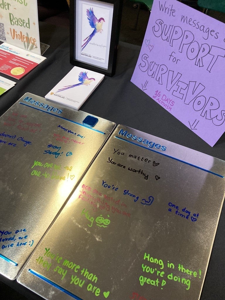 Messages written on a board that support survivors of gender-based violence
