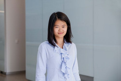Teresa Kang standing in QNC hall