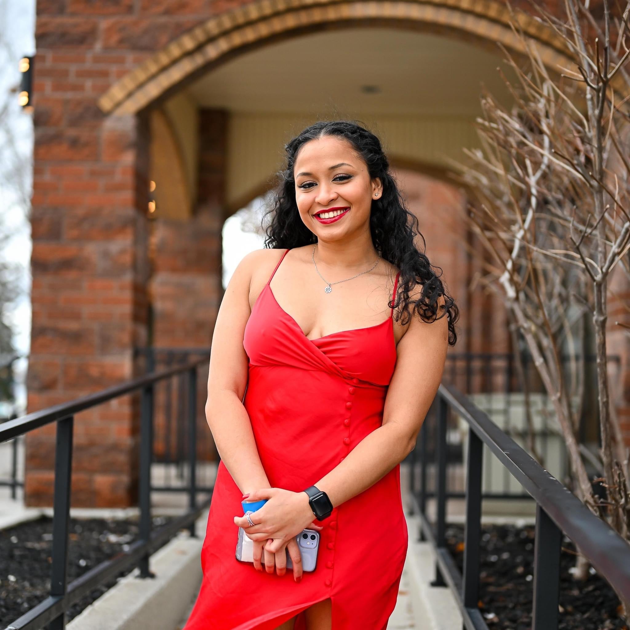 Tharindya Abeyratne poses in red dress