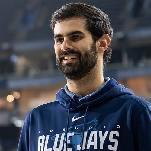 Tommy Farah smiles while standing on the field at Rogers Centre