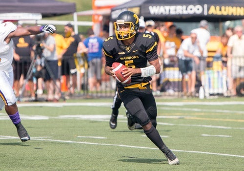 Tre Ford running with football