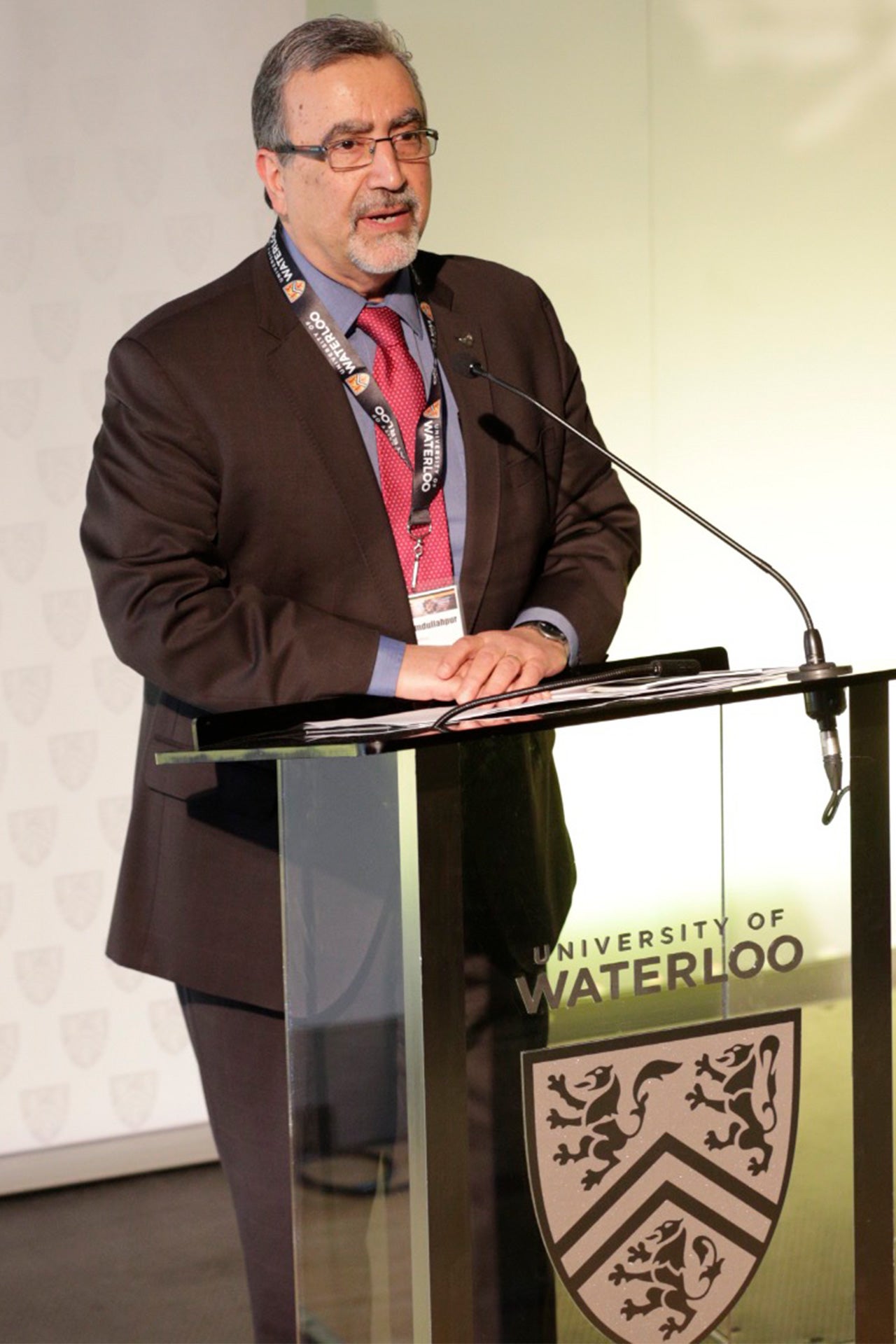 Feridun Hamdullahpur speaking at podium of True North Waterloo