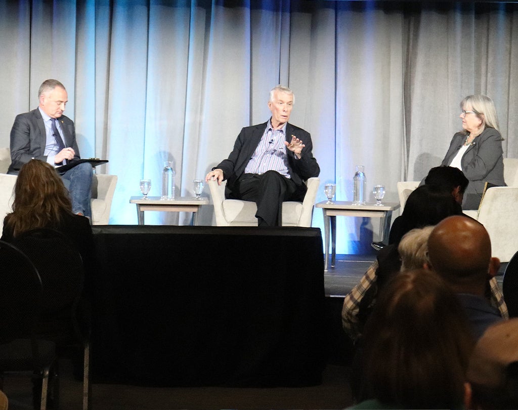 Chris Houser, Richard Roberts, Donna Strickland on stage