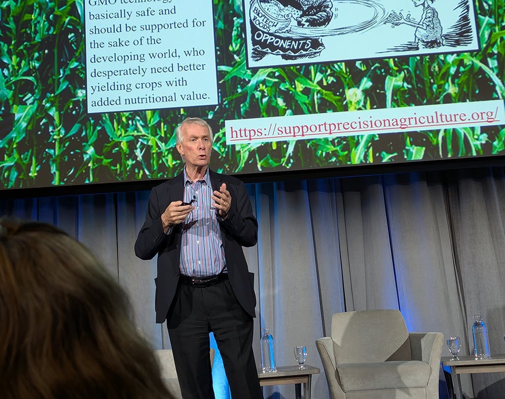 Richard Roberts presenting on a stage