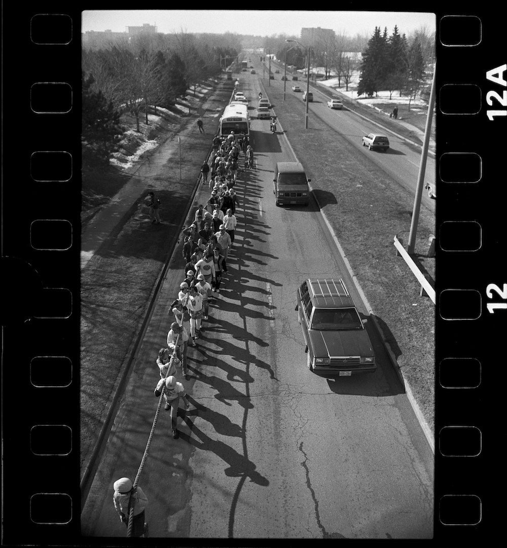 People pulling a bus