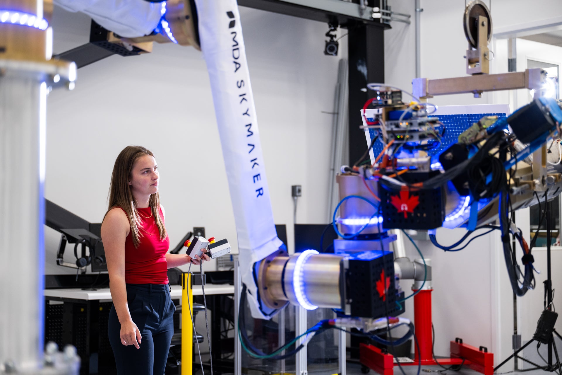 Mary McPhee testing part of the MDA Skymaker prototype robotic arm