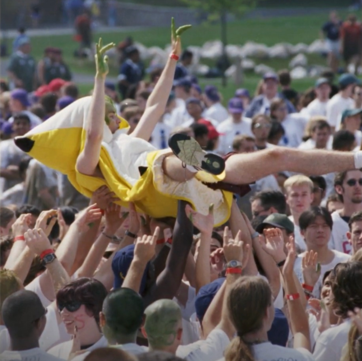The Big Banana crowd surfing with a group of students
