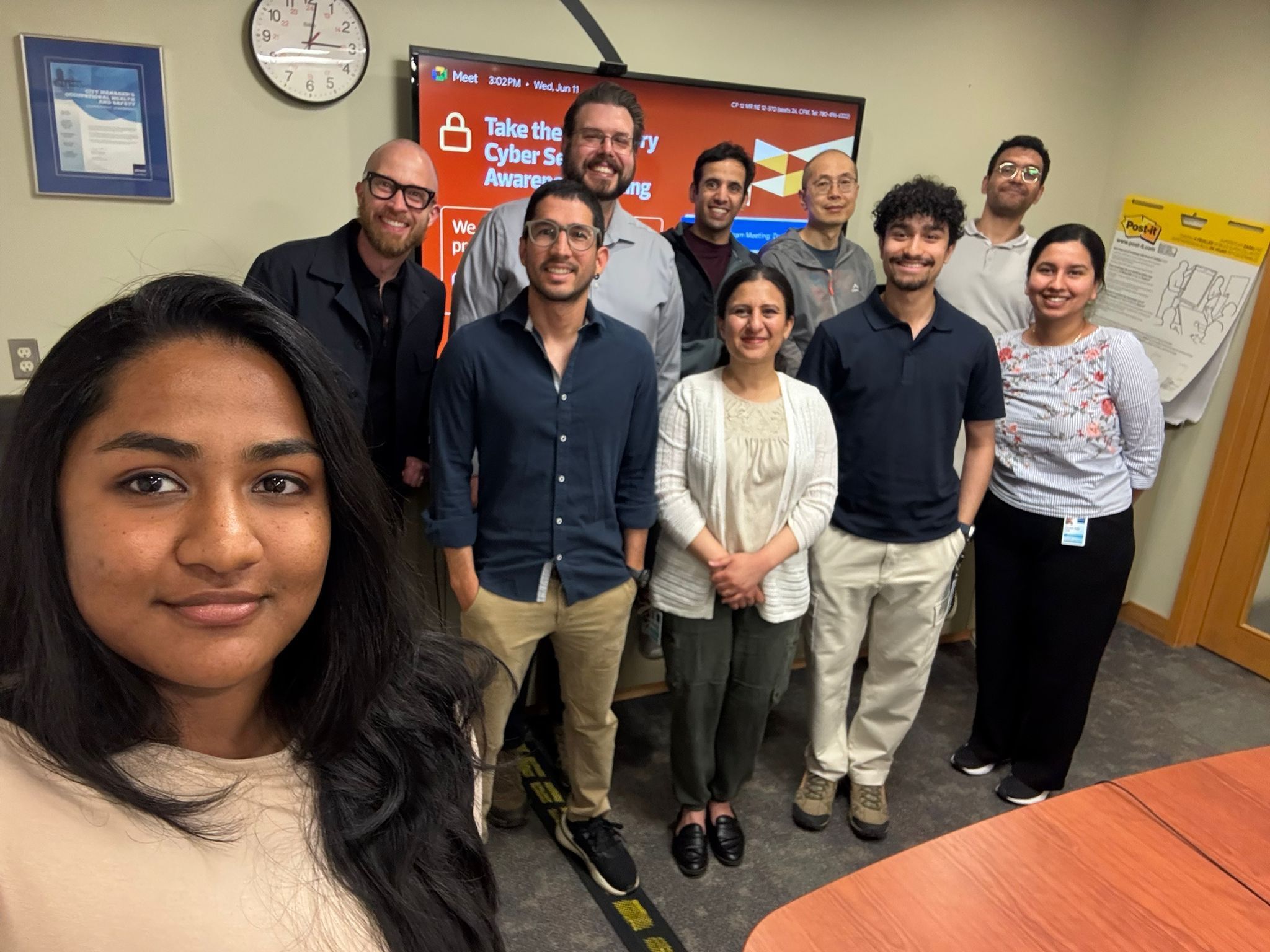 Raghuraman taking a group selfie with the Data Science and Research (DSR) team at the City of Edmonton office