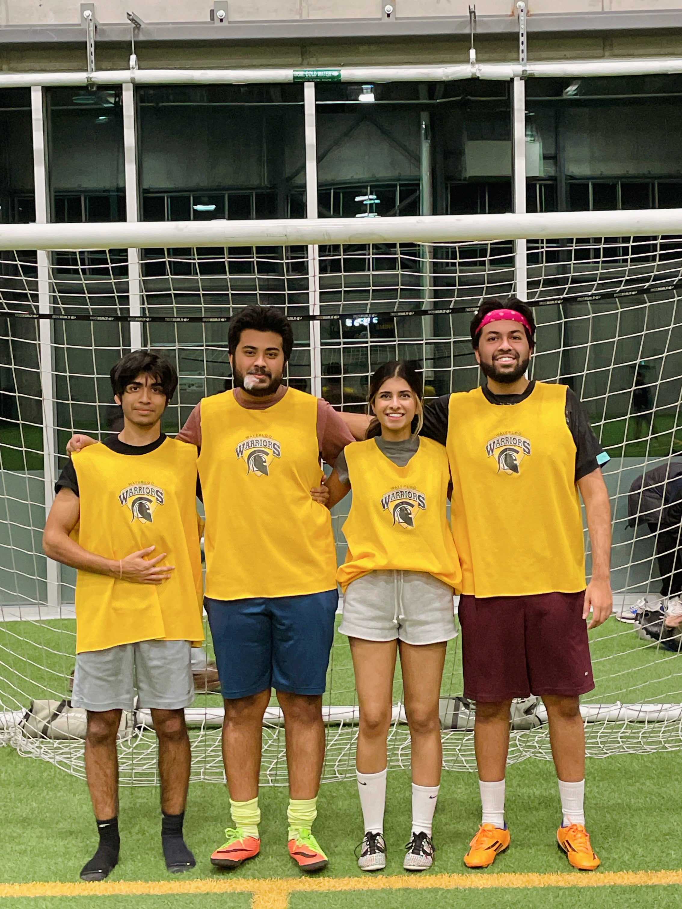 Sapna Tripathi at Waterloo's Field House with her three brothers dressed in soccer jerseys