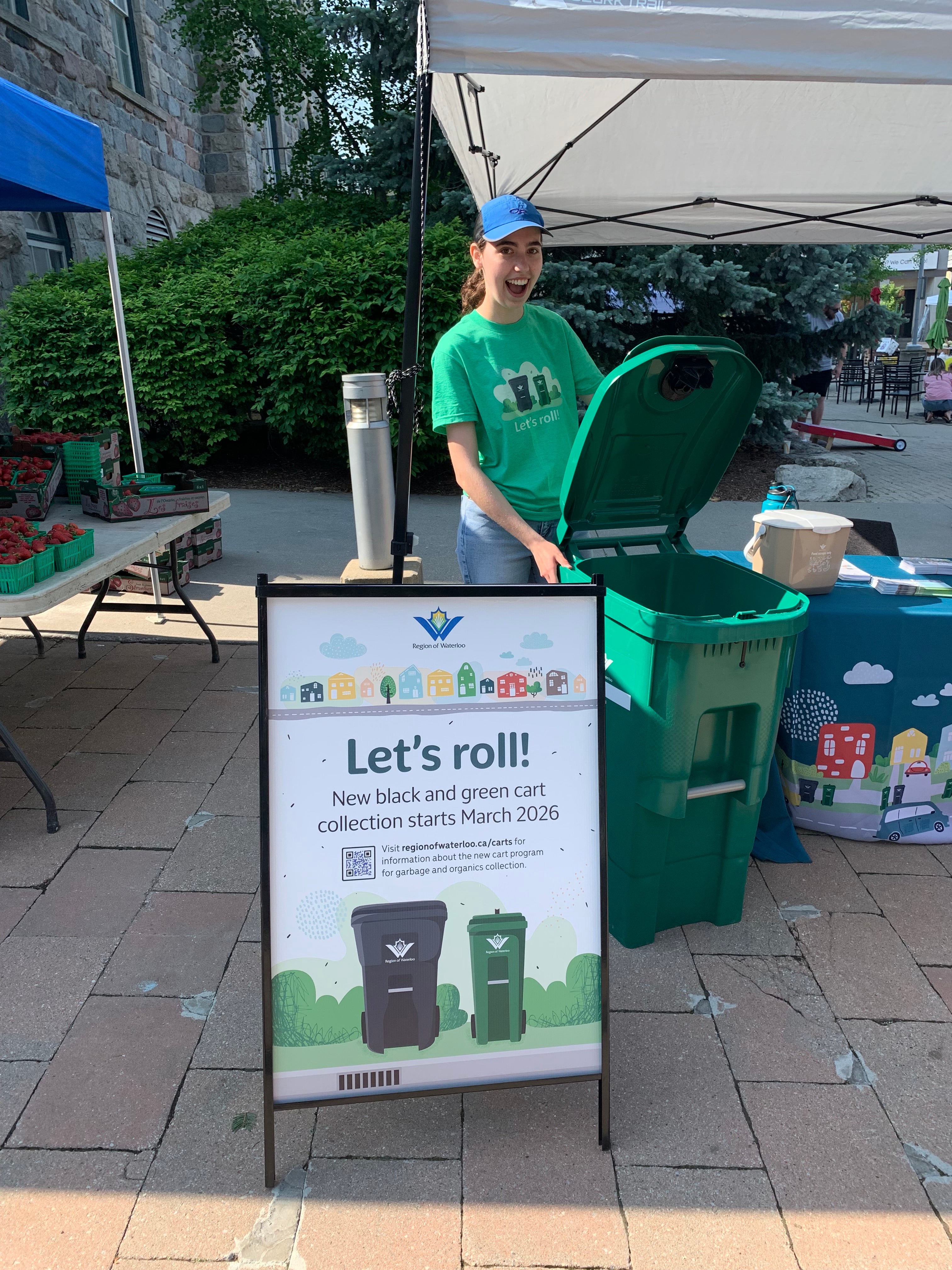 Chloe Sullivan holding a Waterloo region compost bin