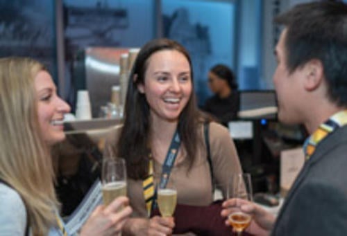 Alumni talk at a networking event