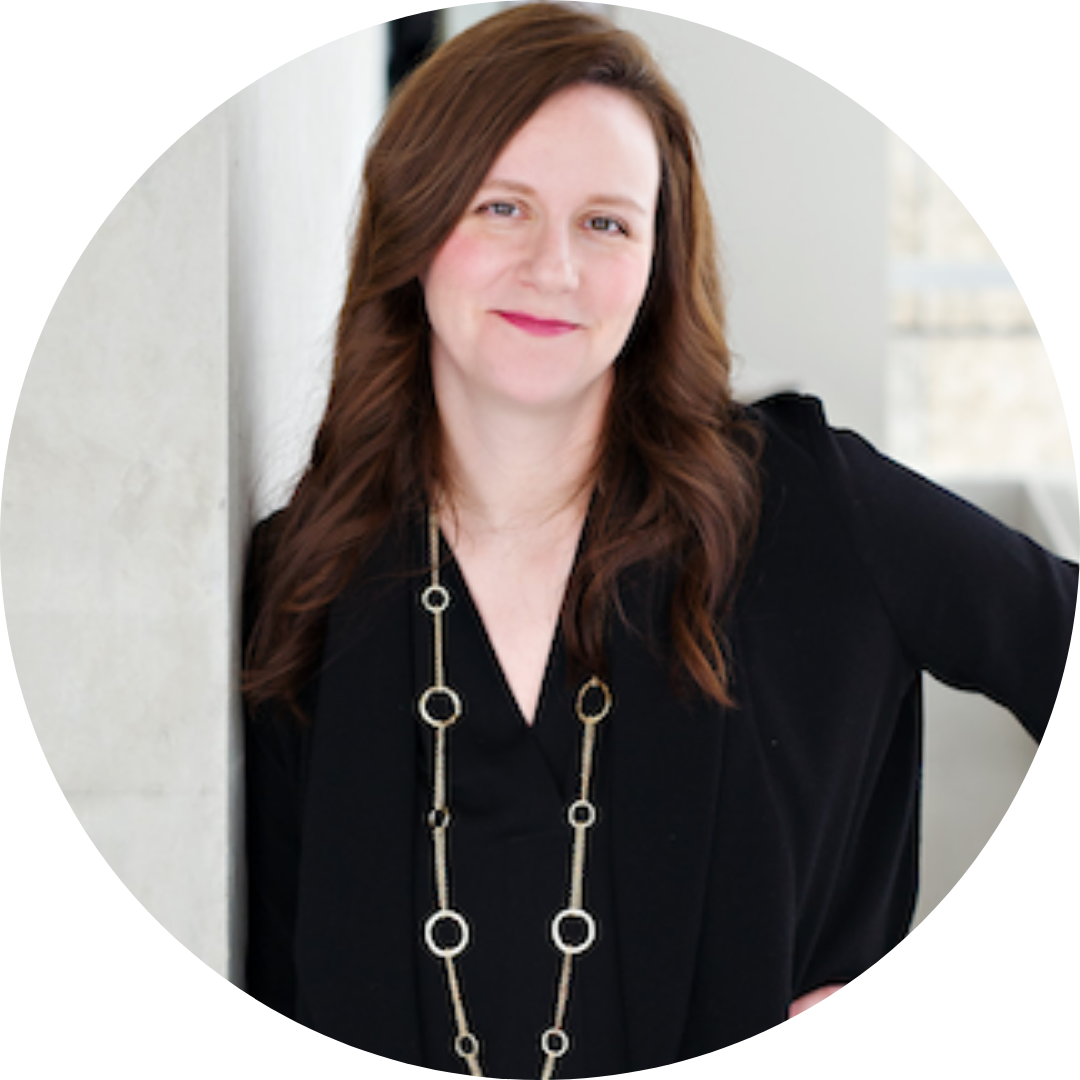 Portrait photo of Kelly Grindrod in a black shirt and silver necklace.