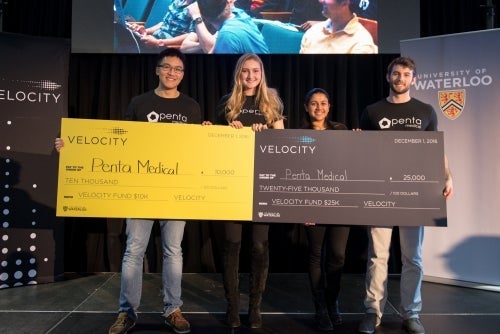 Photo of Penta Medical holding their big cheques