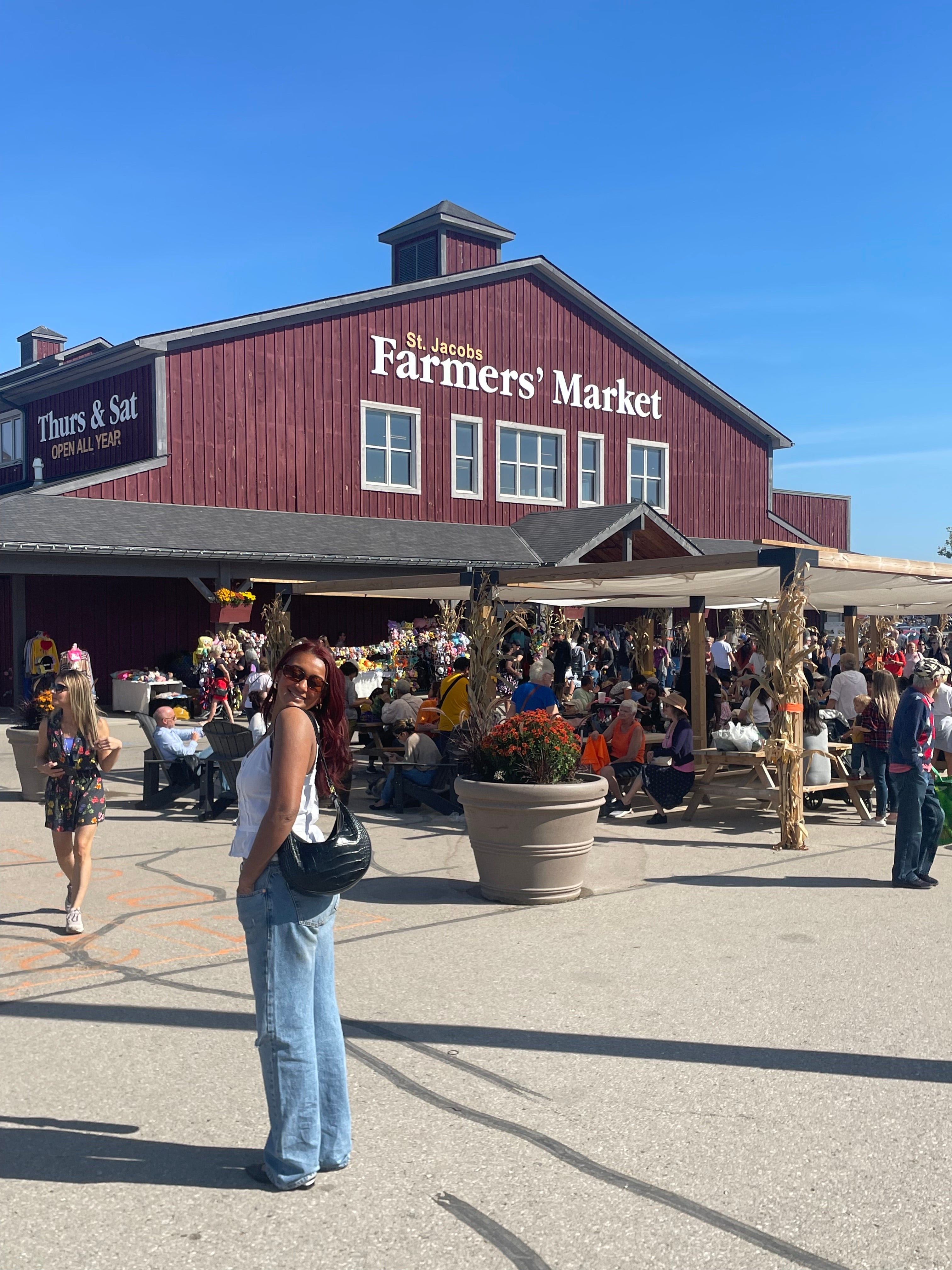 Areena poses in front of St. Jacob's Market