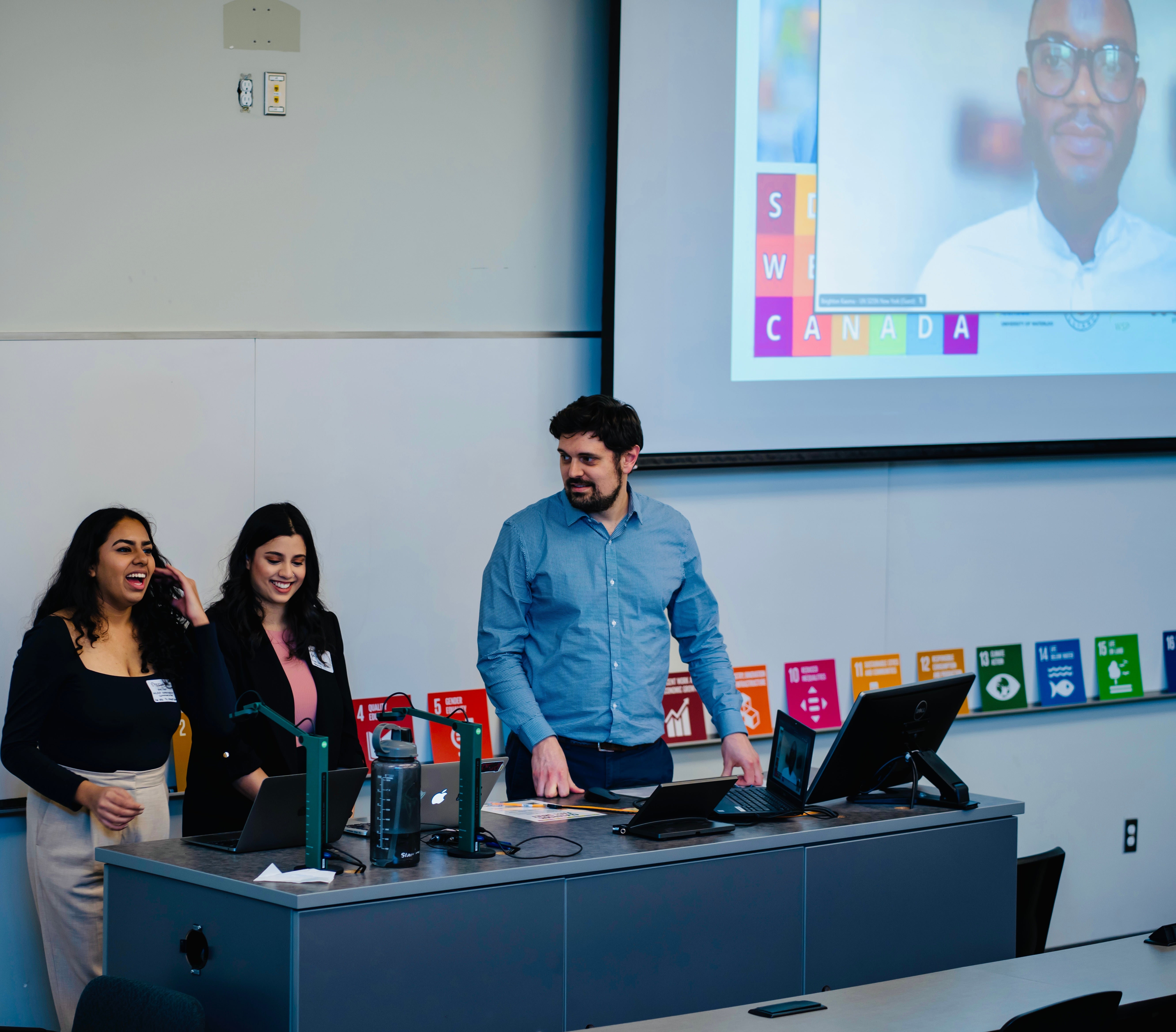 Shreya Rao, Ridham Chadha and Jon Beale introduce Brighton Kaoma as the keynote speaker for an event hosted by SDSN Canada, WUSA
