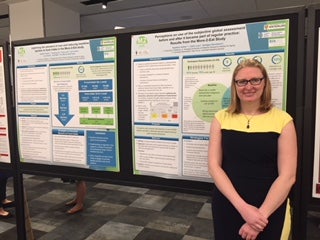 Celia Laur Standing in front of her poster at CNS 2018