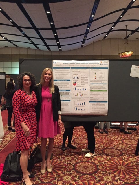 Renata and Heather with conference poster