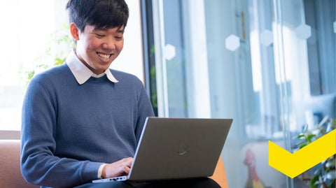 Hoang Do working on laptop