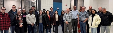 Banner image that shows members attending a water treatment plant tour
