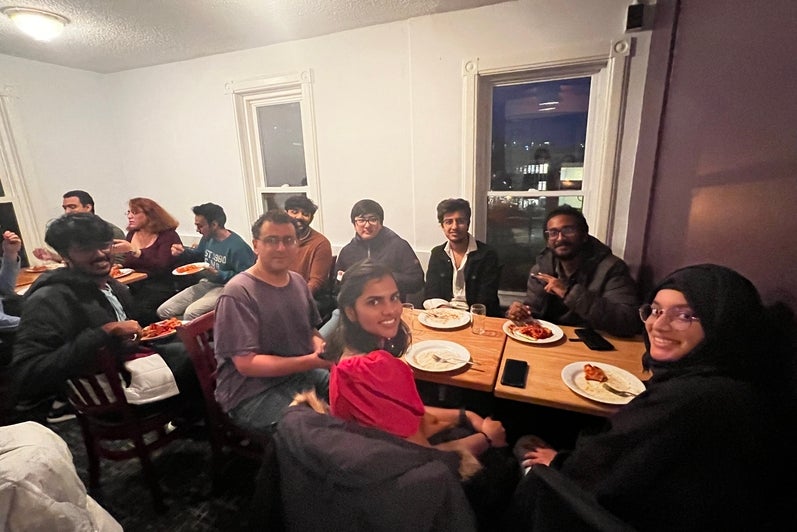 group of students with their food at a table