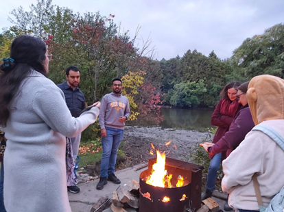People standing around a fire
