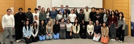 The class of 2026 line up for a group photo