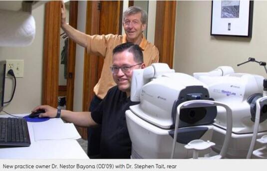 Drs. Steven Tait and Nestor Bayona sit together in their clinic.
