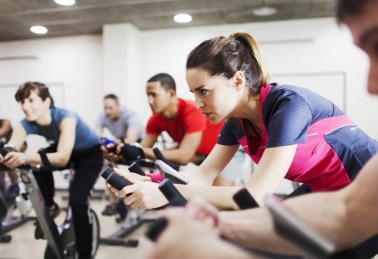 Image of athletes training on exercise bicycles