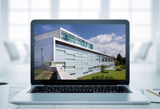 Photo of the School on a laptop screen
