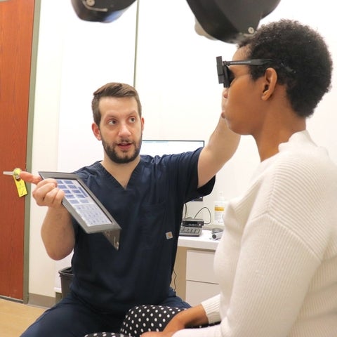 Dr. Jonathan Niavis examines patient with autism