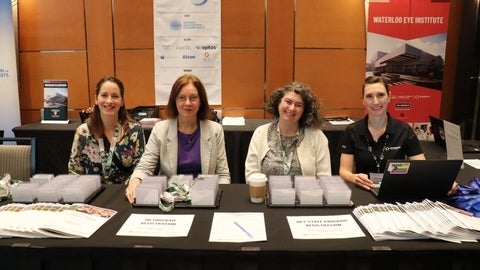 Four women at registration table