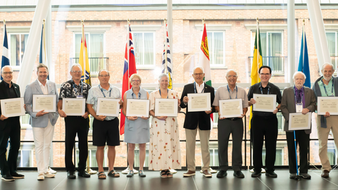 CAO past presidents lined up and holding their honorary memberships