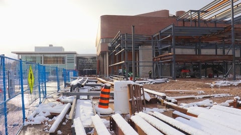 The new expansion project under construction with the steel substructure of the building visible.