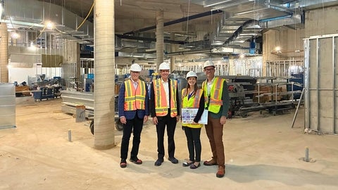 Dr. Ben Thompson and Kelsey Gagnon tour the WEI building space with project leads