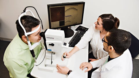 Students perform an eye exam in clinic